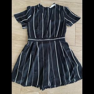 Black and white pin strip romper